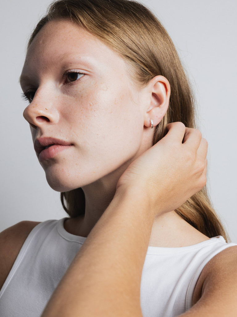 Organic Huggie Hoops (Silver) by Wolf Circus