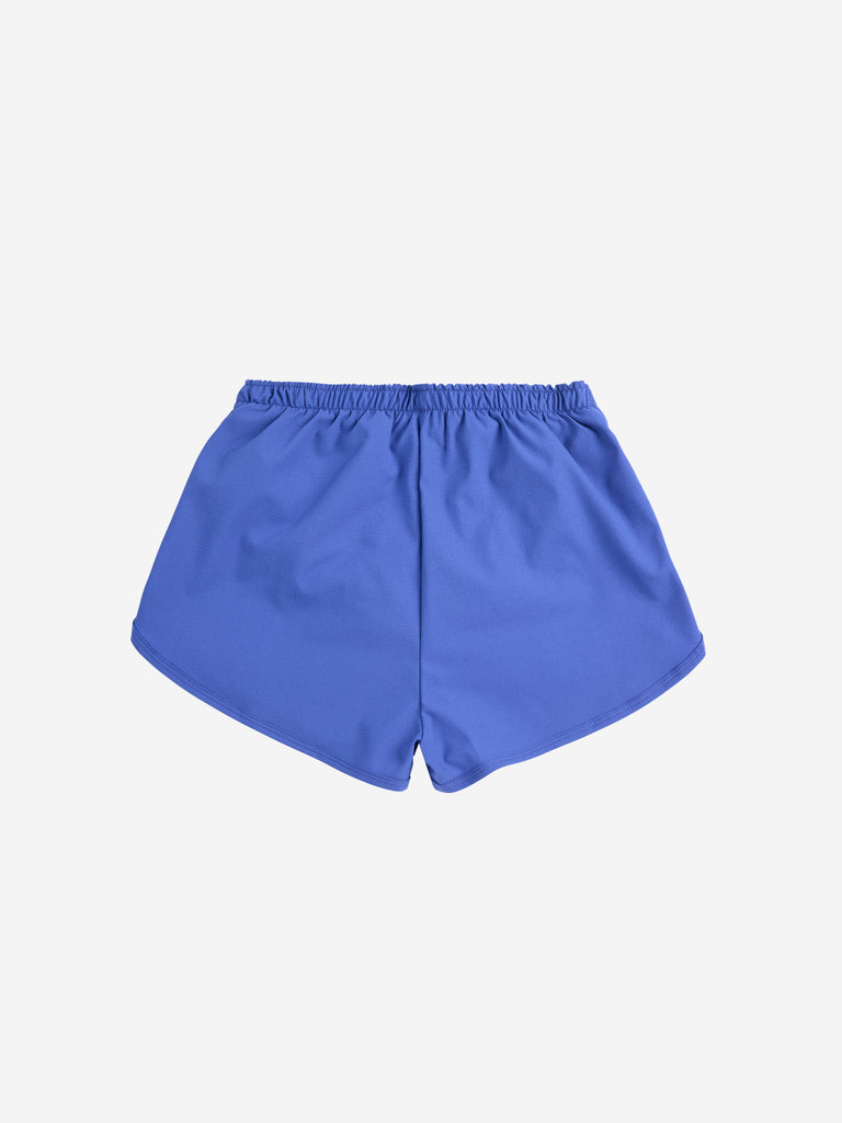 A Day At The Beach Swim Trunks (Kids) by Bobo Choses