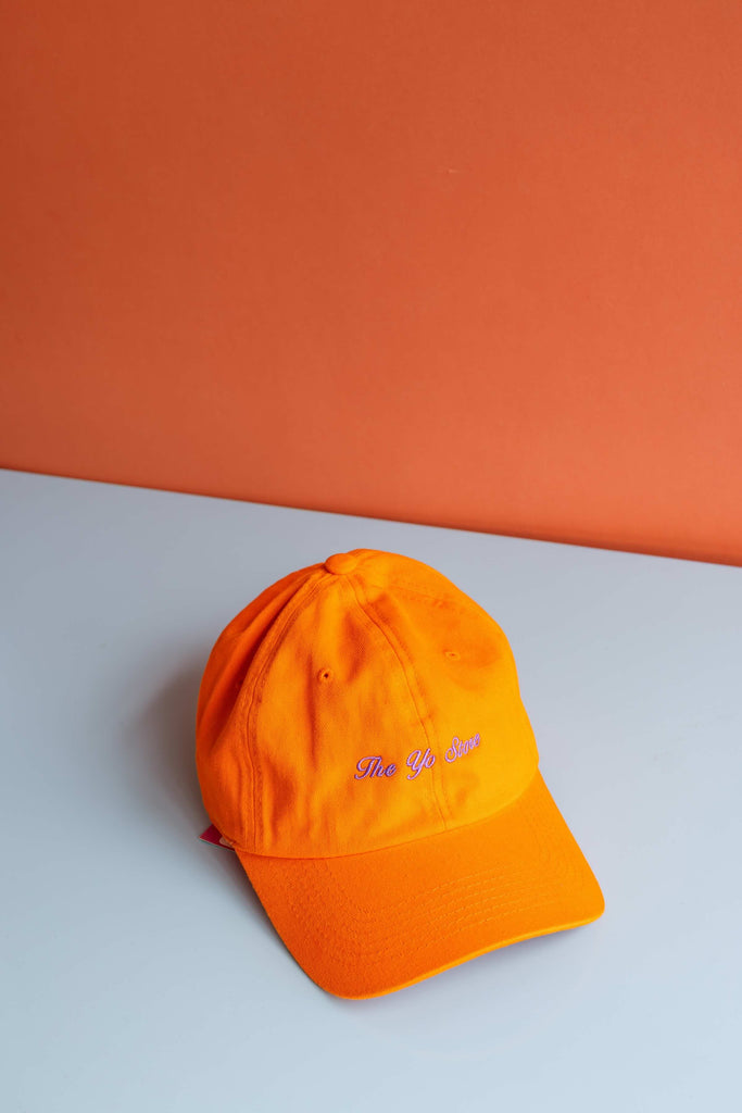 Script The Yo Store Cap (Lilac on Orange) by Intentionally Blank