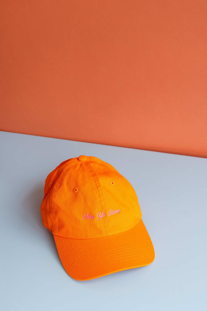 Script The Yo Store Cap (Pink on Orange) by Intentionally Blank