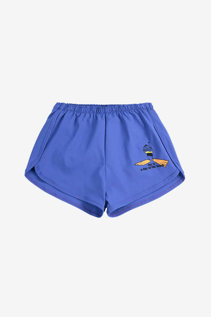 A Day At The Beach Swim Trunks (Kids) by Bobo Choses